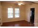 Sunlit living room with hardwood floors and neutral walls at 436 E Oakwood Ave, Albemarle, NC 28001