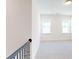 Bright, carpeted bedroom with natural light streaming through two windows at 10108 Whitaker Pointe Dr, Huntersville, NC 28078