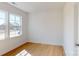 Bright, airy bedroom with two large windows, hardwood flooring, and fresh white walls at 10108 Whitaker Pointe Dr, Huntersville, NC 28078