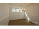 Bright dining room with hardwood floors, chandelier, and wainscoting at 10108 Whitaker Pointe Dr, Huntersville, NC 28078