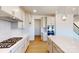 Modern kitchen with white cabinets, stainless steel appliances, and a gas range cooktop at 10108 Whitaker Pointe Dr, Huntersville, NC 28078