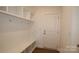 Mudroom with built-in bench, cubbies, and hooks at 10108 Whitaker Pointe Dr, Huntersville, NC 28078