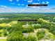 An aerial view of a neighborhood surrounded by nature showing the proximity to Mint Hill at 112 Berea Baptist Church Rd, Stanfield, NC 28163