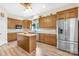 Well-equipped kitchen featuring granite countertops, a center island, stainless steel appliances, and wood flooring at 112 Berea Baptist Church Rd, Stanfield, NC 28163