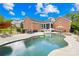 Relaxing pool area with lounge chairs, hot tub, and a fully fenced yard perfect for outdoor entertaining at 112 Berea Baptist Church Rd, Stanfield, NC 28163