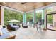 Screened in porch with a view of the pool and blue furniture at 112 Berea Baptist Church Rd, Stanfield, NC 28163