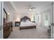 Main bedroom with a king-size bed and access to the backyard at 1180 Weir Ct, Fort Mill, SC 29708