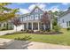 Two-story home with front porch and landscaped yard at 1180 Weir Ct, Fort Mill, SC 29708