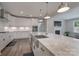 Modern kitchen with white cabinets and large island at 1180 Weir Ct, Fort Mill, SC 29708