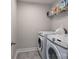 Laundry room with washer, dryer, and ample storage at 1180 Weir Ct, Fort Mill, SC 29708