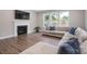 Living room with fireplace and large windows offering natural light at 1180 Weir Ct, Fort Mill, SC 29708