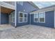 Spacious patio with gray pavers adjacent to a blue house at 1180 Weir Ct, Fort Mill, SC 29708