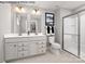 Stylish bathroom with dual sinks, a modern vanity, and a glass-enclosed shower, perfect for relaxation at 467 Hollis Dr # 0055, Lancaster, SC 29720