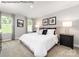 Serene bedroom featuring a comfortable bed, neutral decor, and large windows for natural light at 467 Hollis Dr # 0055, Lancaster, SC 29720