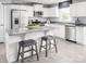 Modern kitchen featuring stainless steel appliances, granite countertops, and a kitchen island with seating at 467 Hollis Dr # 0055, Lancaster, SC 29720