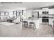 Open-concept living space with a kitchen island, stainless appliances, and a connected sitting area at 467 Hollis Dr # 0055, Lancaster, SC 29720