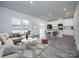 Open-concept living area featuring hardwood floors connecting to the kitchen and dining area at 104 Alden Ct, Shelby, NC 28152