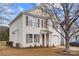 View of a charming home with a well-manicured lawn, a one-car garage and neutral siding at 4242 Quinn Dr, Charlotte, NC 28269