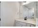 Beautiful bathroom with a quartz countertop, modern fixtures, and a large mirror for added convenience at 2008 Embassy Ct # 45, Charlotte, NC 28213