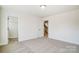 Spacious bedroom with plush carpeting and a view to a walk-in closet, perfect for relaxation at 2008 Embassy Ct # 45, Charlotte, NC 28213