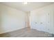 Spacious bedroom with neutral carpet and white doors leading to other areas of the home at 2008 Embassy Ct # 45, Charlotte, NC 28213
