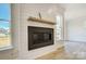 Close up of a stylish fireplace and a view of the large window at 2008 Embassy Ct # 45, Charlotte, NC 28213