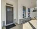 Welcoming front porch showcasing the stylish front door, windows and stone accents at 2008 Embassy Ct # 45, Charlotte, NC 28213