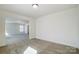 Bright living room with neutral walls and plush carpeting, perfect for relaxing and entertaining guests at 2008 Embassy Ct # 45, Charlotte, NC 28213