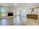 Bright, open living space with modern fireplace, and a view of the kitchen with center island at 2008 Embassy Ct # 45, Charlotte, NC 28213