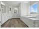 Spacious bathroom featuring double sinks, a large soaking tub, and stylish fixtures for a luxurious experience at 3253 Mcharney Dr # 27, Harrisburg, NC 28075