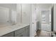 Bathroom vanity with gray cabinets, a white countertop, and brushed nickel hardware at 3253 Mcharney Dr # 27, Harrisburg, NC 28075