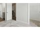 Bedroom featuring plush carpet and open doorways to the bathroom and walk-in closet at 3253 Mcharney Dr # 27, Harrisburg, NC 28075