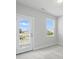 Bright bedroom with a door to the outside and windows allowing for plenty of natural light at 3253 Mcharney Dr # 27, Harrisburg, NC 28075