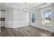 Dining room boasts hardwood floors, decorative molding, chandelier, and lots of windows at 3253 Mcharney Dr # 27, Harrisburg, NC 28075