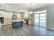 Modern kitchen with island, stainless steel appliances, and white cabinets at 3253 Mcharney Dr # 27, Harrisburg, NC 28075