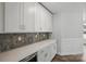 Beautiful kitchenette boasts modern cabinets and backsplash at 3253 Mcharney Dr # 27, Harrisburg, NC 28075