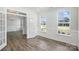 Bonus room features hardwood floors, decorative molding, lots of light, and glass French doors at 3253 Mcharney Dr # 27, Harrisburg, NC 28075