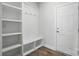 Mudroom area with built in shelves and bench seating with hooks at 3253 Mcharney Dr # 27, Harrisburg, NC 28075