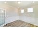 Light-filled office with wainscoting and hardwood floors at 3253 Mcharney Dr # 27, Harrisburg, NC 28075