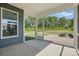 Back porch featuring concrete floors, screens, and a beautiful backyard view at 3253 Mcharney Dr # 27, Harrisburg, NC 28075