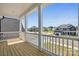 Inviting front porch with white columns and railings, offering neighborhood views at 3253 Mcharney Dr # 27, Harrisburg, NC 28075