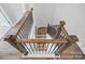 View from above showcasing the staircase with wood accents and modern black wrought iron spindles at 3253 Mcharney Dr # 27, Harrisburg, NC 28075