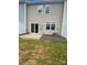 Private backyard with a concrete patio, lush grass, and a well-maintained fence at 3933 Townes Blvd, Terrell, NC 28682