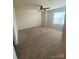 Spacious bedroom with a ceiling fan, neutral walls, carpet, and a window at 3933 Townes Blvd, Terrell, NC 28682