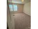 Bedroom featuring neutral walls, carpet, and a window providing natural light at 3933 Townes Blvd, Terrell, NC 28682