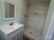 Updated bathroom featuring a new vanity and tiled walk-in shower at 611 Greenbriar Ave, Rock Hill, SC 29730