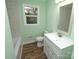 Bathroom with new vanity, fixtures, tub, and tiled shower walls at 611 Greenbriar Ave, Rock Hill, SC 29730