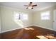 Bright bedroom featuring hardwood floors and natural light from two windows at 611 Greenbriar Ave, Rock Hill, SC 29730