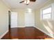 Bright bedroom featuring a ceiling fan, wood floors, neutral paint, and a closet at 611 Greenbriar Ave, Rock Hill, SC 29730