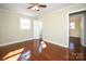 Bedroom featuring hardwood floors, ceiling fan, and views to the bath at 611 Greenbriar Ave, Rock Hill, SC 29730